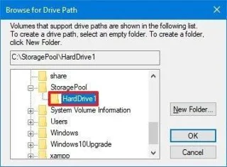 Arahan untuk memasang cakera keras ke dalam folder pada Windows 10