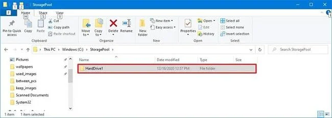 Arahan untuk memasang cakera keras ke dalam folder pada Windows 10